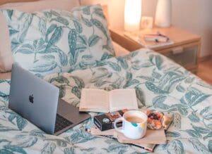 image of laptop on a bed